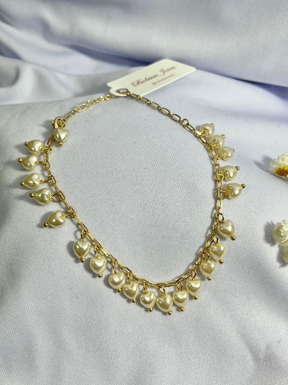 Pulseira Cartier com pingentes de pérola em formato de coração